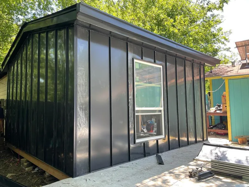 Black standing seam metal wall panels for Metal Roof Installation in Texas